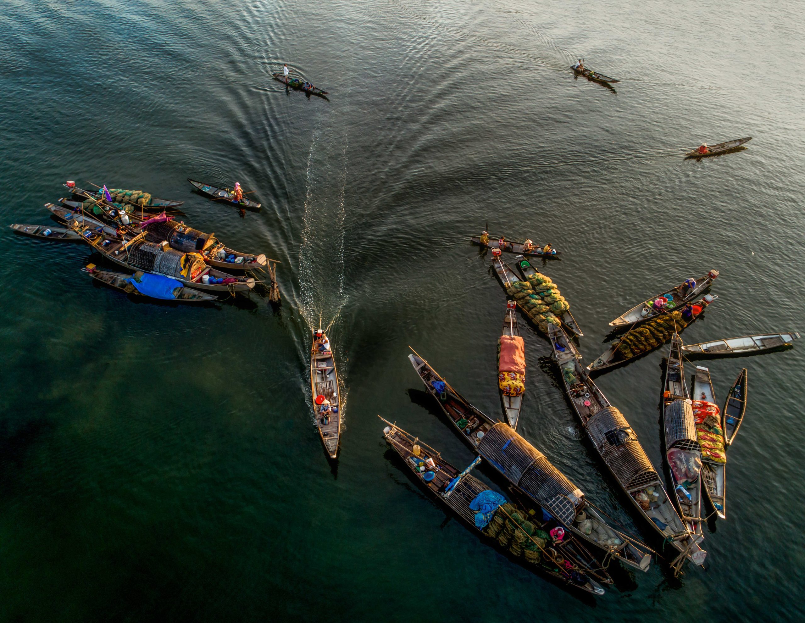 Aerial view of wooden boats at a floating market in Vietnam — Mohamed Bourbiza visual journalism portfolio